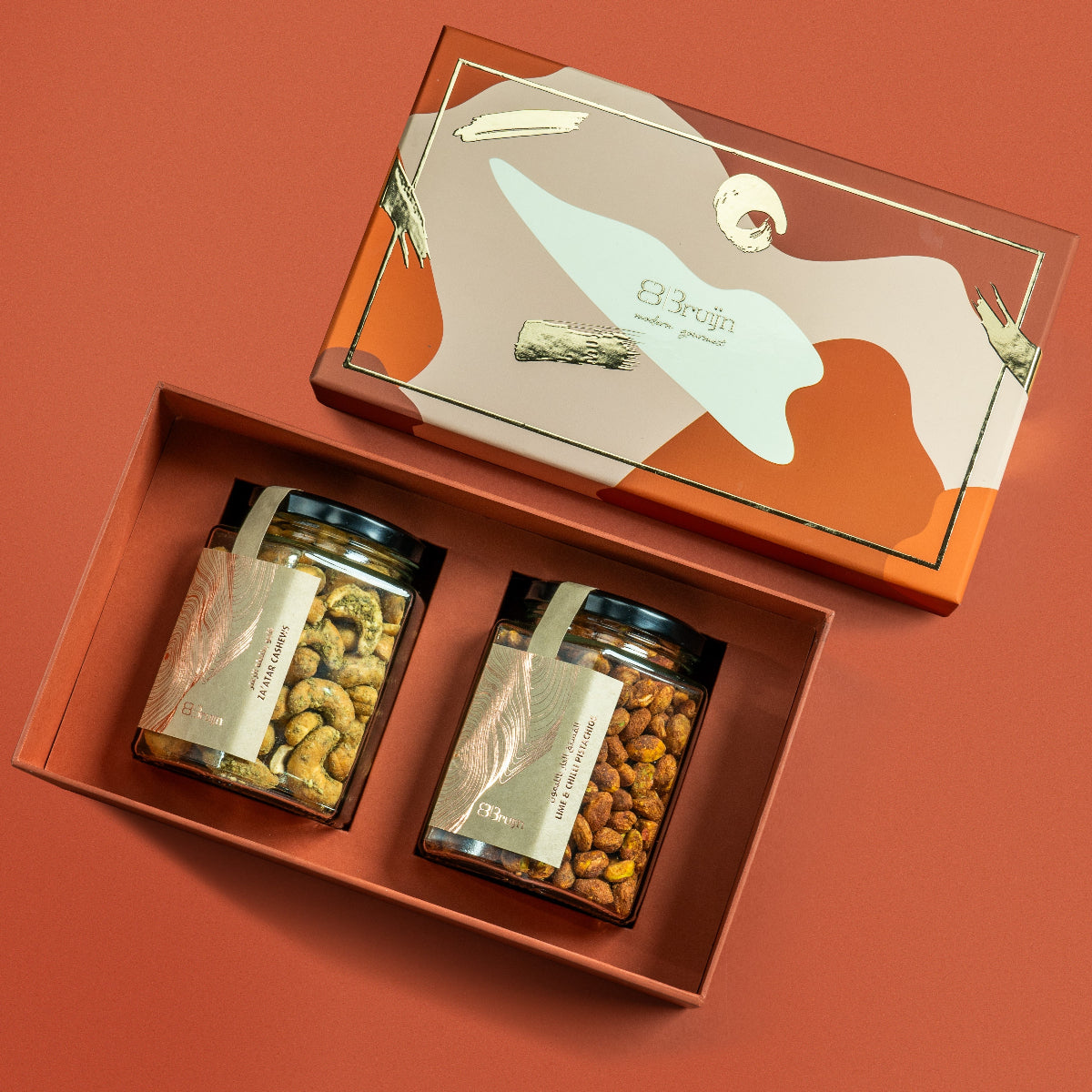 Open box from tower gift set featuring Za’atar cashews and lime chilli pistachios.