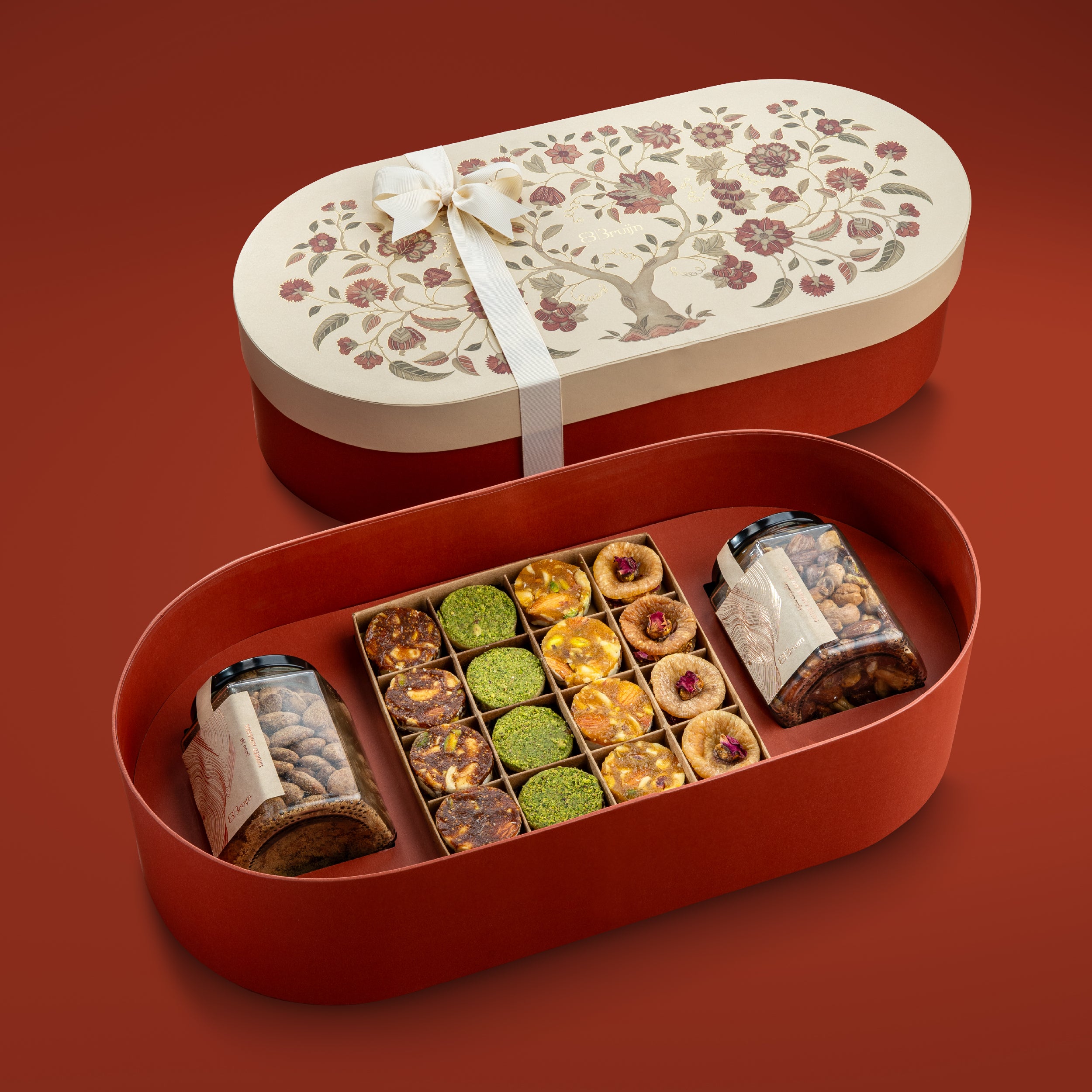 an open box with assorted nuts & dried fruit in tree of life box.