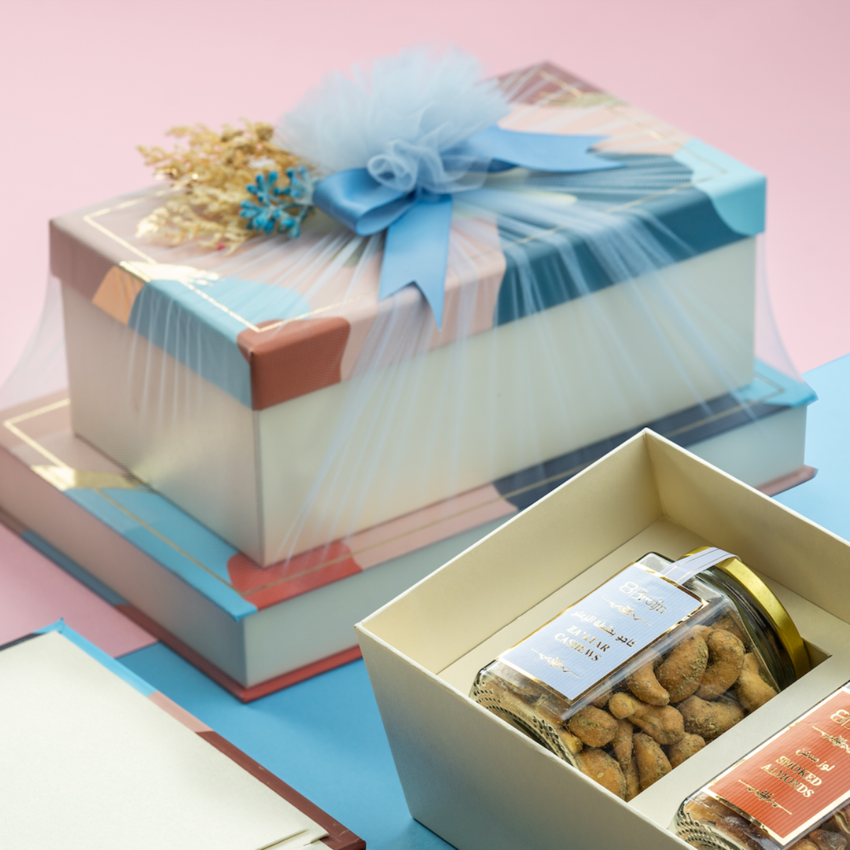 Gourmet gifting set featuring Za’atar cashews, caramel nut mix, fig tarts, dark chocolate, and hazelnut dates
