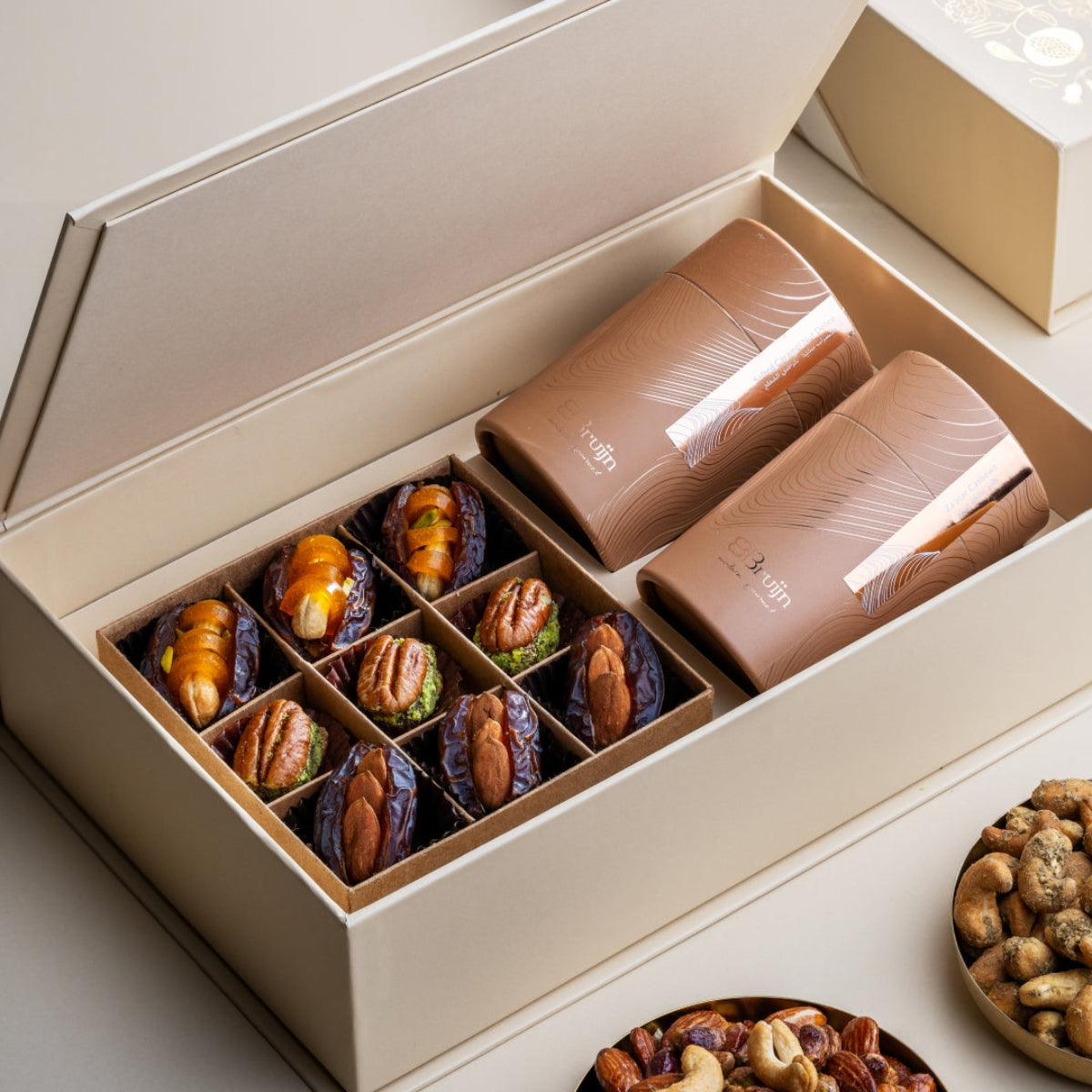 Luxurious Grand Box from Stories of Bruijn Edition with artisanal stuffed dates, Za’atar cashews, and salted caramel nut mix in premium packaging.