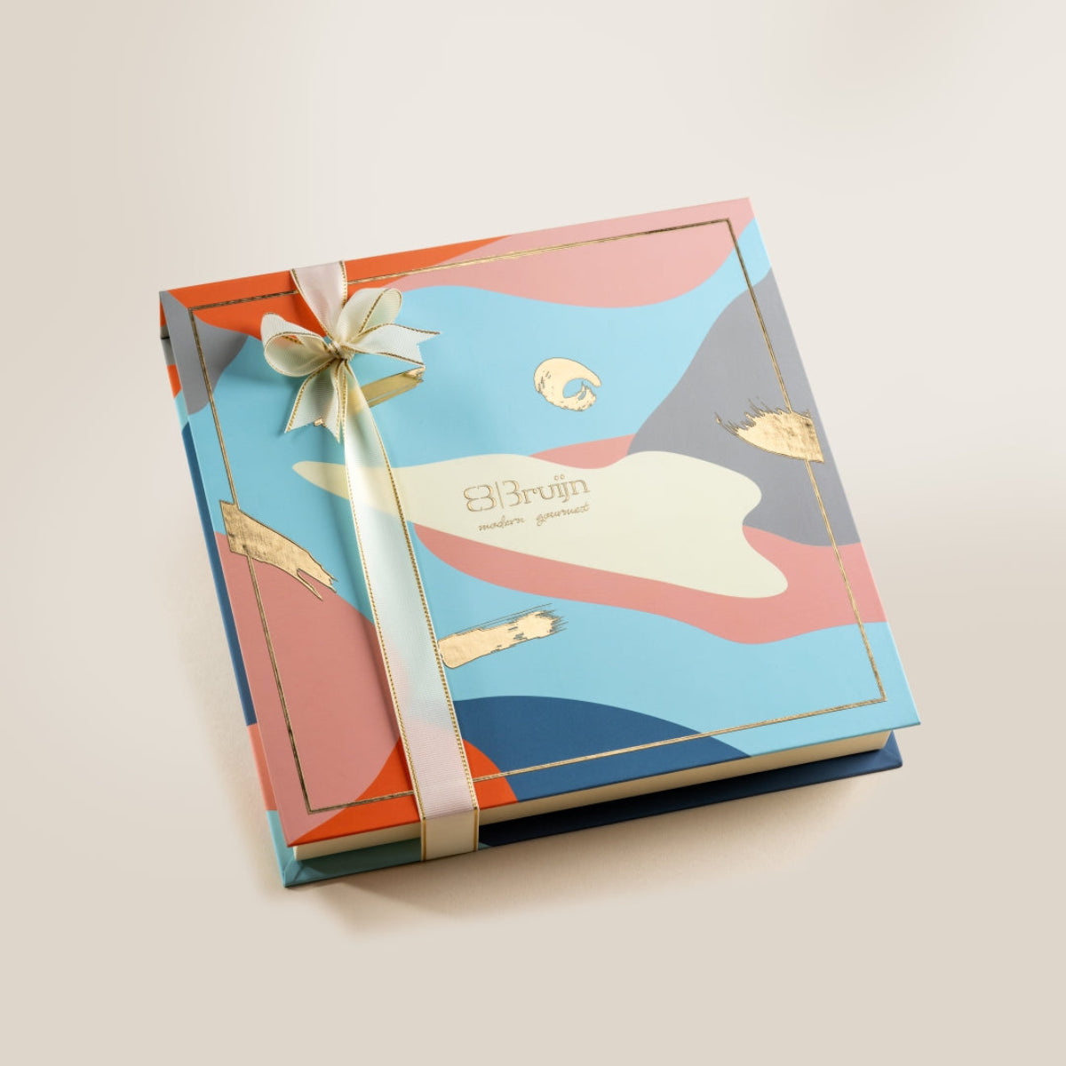 Elegant Bruijn Opulent Dates Collection gift box with abstract design and golden ribbon.