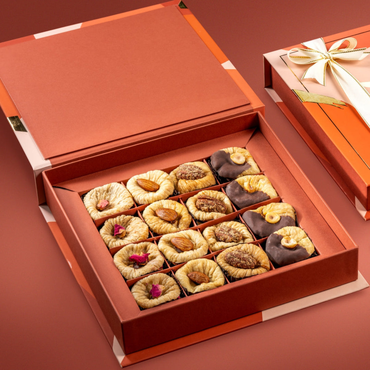 Open Bruijn Fig Collection box with saffron pistachio, orange peel, ginger pecan, and chocolate hazelnut figs.
