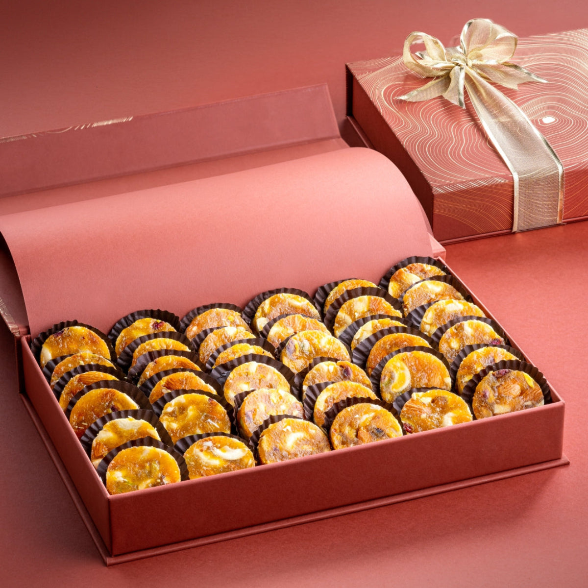 Rust Box with 1kg of signature fig and nut bites, made with roasted nuts rolled in apricot paste, beautifully packed for weddings, gifting, or celebrations.