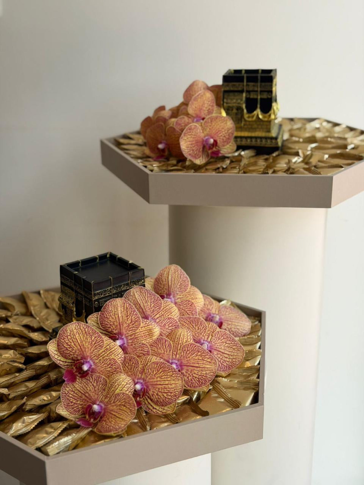 Hexagon trays with wrapped fig & nut bites, Phalaenopsis orchid & Kaaba