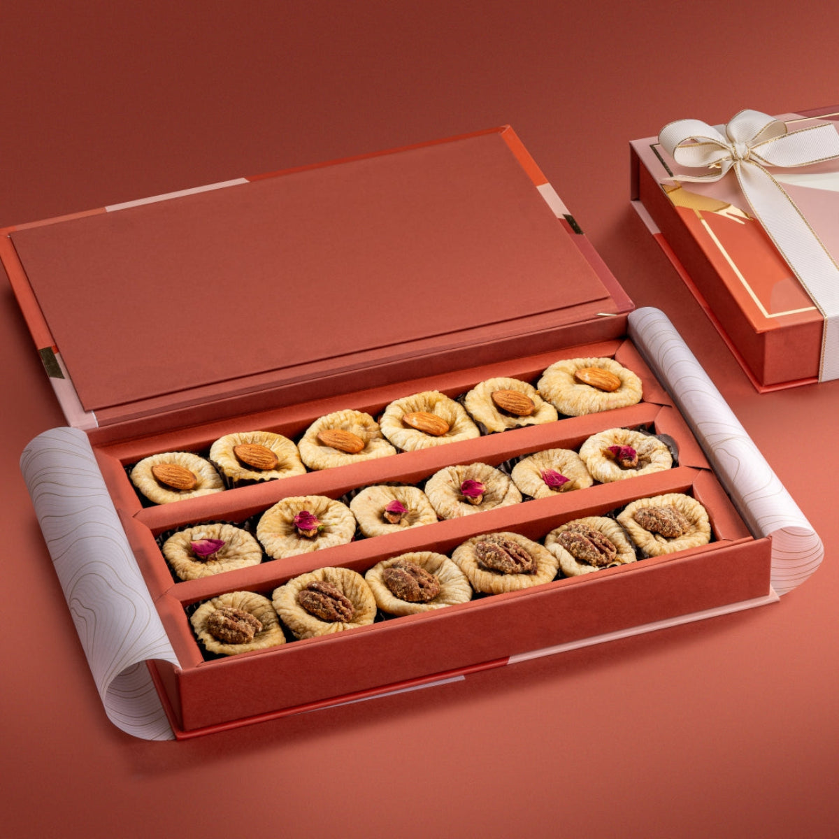 Open Fig Collection gift box with almond orange peel figs, saffron pistachio rose figs, and ginger pecan figs.