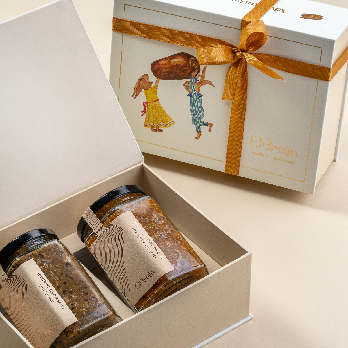 Fun & Frolic gift box with two gourmet jars, displayed open for gifting.