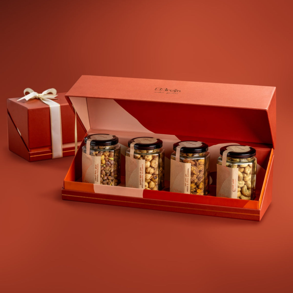 Open Bruijn festive jar box with Saffron Pistachio, Spicy Caramel Hazelnut, Cheese & Chilli Almonds, and Thai Cashew jars.