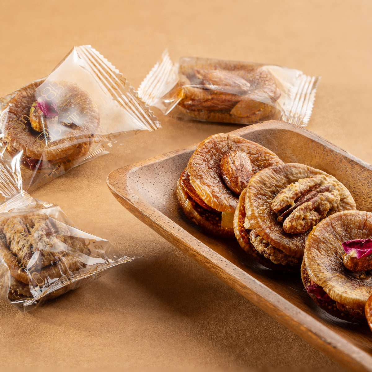 Assorted stuffed fig with nuts & dried fruits in individually wrapped packaging.
