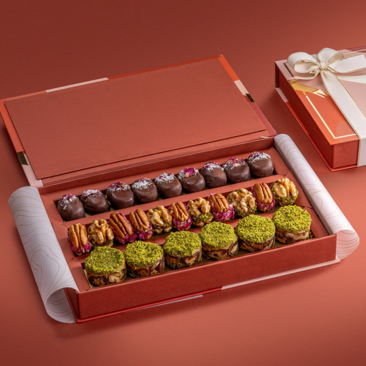 Open Motley Collection gift box with paan bites, walnut & date wholes, pecan & dried fruit wholes, and ranginak.