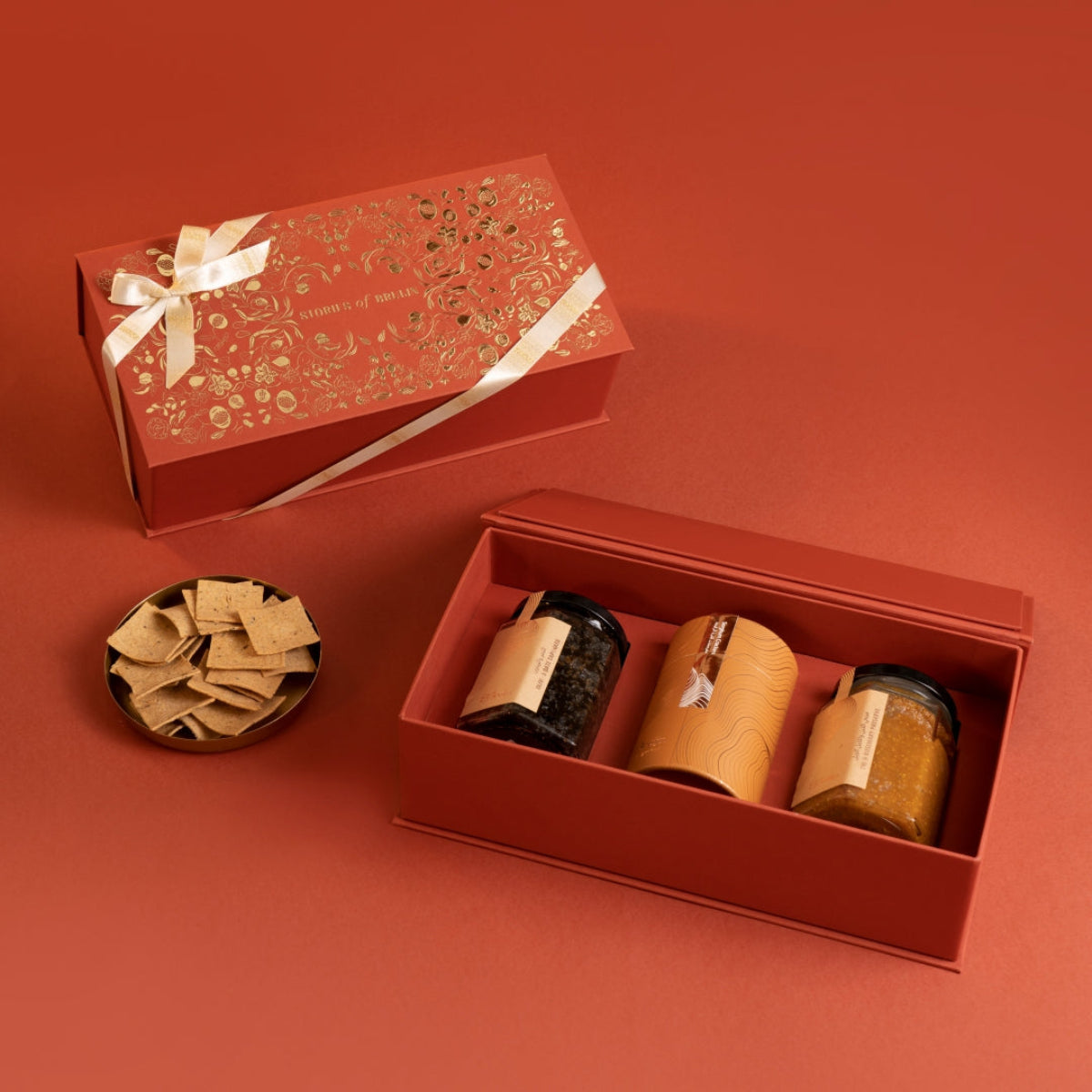 Gift box with artisanal Date & Olive Tapenade, Fig & Rosemary Spread, and sorghum chips, beautifully packed for indulgence.