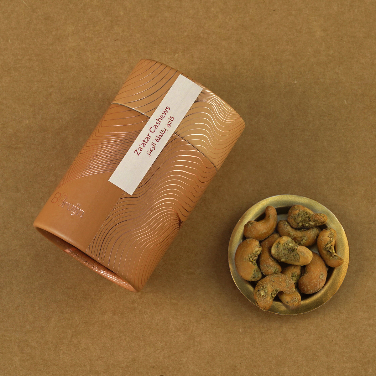 Biodegradable cylinder pack displayed with zaatar cashews