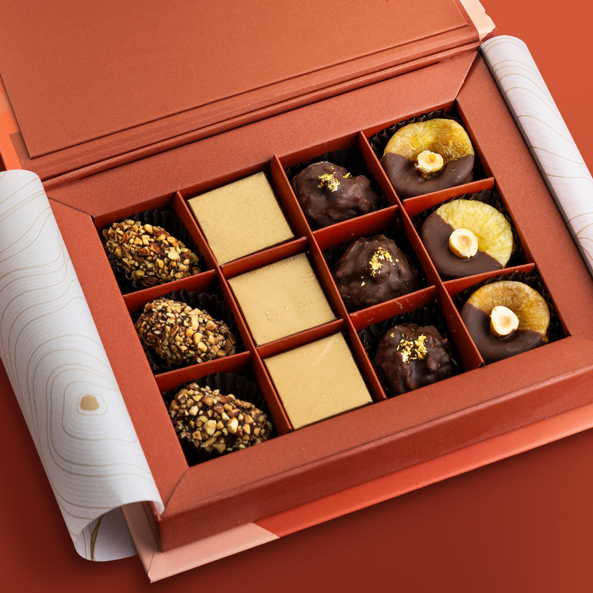 330g of mouth melting date truffles encrusted with diced nuts, pure cacao chocolate with nuts, 24K sprinkled almond rocks and cinnamon & hazelnut figs.