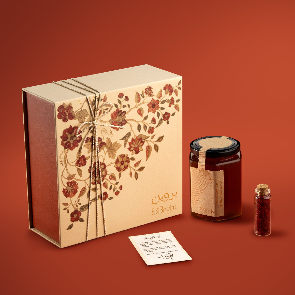 Tree of life design on a gift box in off-white & orange color with saffron & honey. 