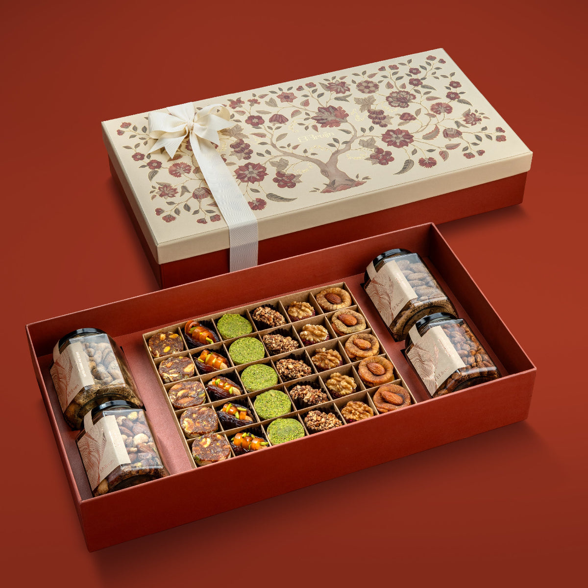 Open box with tree of life design with nuts & dried fruits.