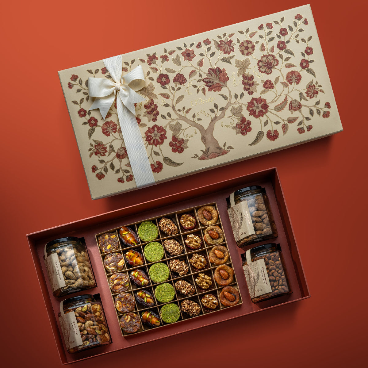 Open box with tree of life design with nuts & dried fruits.
