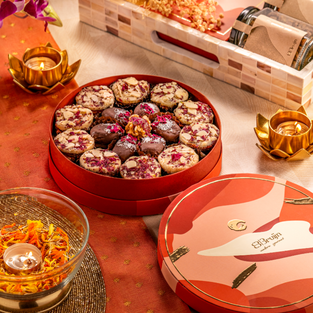 Round box with Persian Rose Delight, paan bites, and walnut & dried fruit wholes.