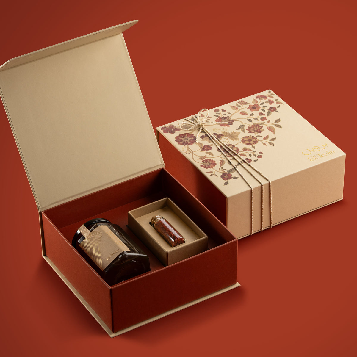 Tree of life design on a gift box in off-white & orange color with saffron & honey.  