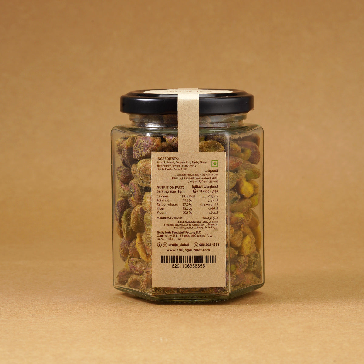 Glass jar of Bruijn Chimichurri Pistachios with black lid and kraft label, filled with pistachios coated in green herb and spice chimichurri seasoning.